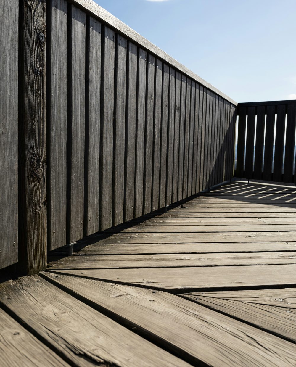 A weathered gray deck due for resealing
